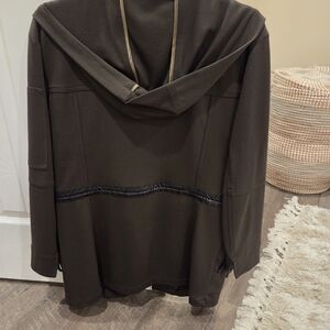 Dark Gren Hooded Jacket with Black Trim With No Zipper Its Drawstring.